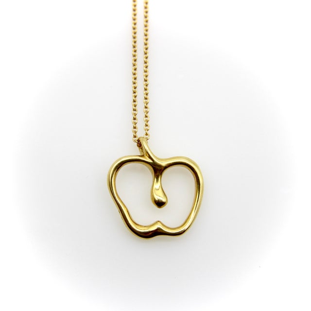 This vintage 18k gold necklace was designed by Elsa Peretti for Tiffany & Co. In just a simple outline, Elsa Peretti was...