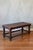 This beautifully hand-tooled Peruvian piece adds charm and can serve as either a bench or a coffee table. It has wooden...