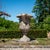 Large cast stone krater vase with a patinated surface in the Neoclassical style. Designed as a garden planter, the vase...