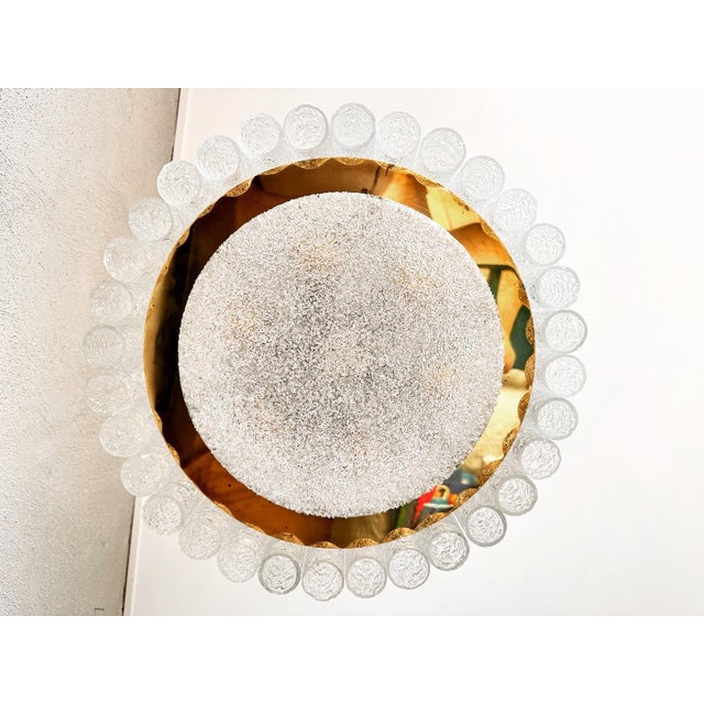 Large round midcentury ceiling lamp by Doria Leuchten, Germany. Surrounding 32 thick hand-blown round glass tubes with...