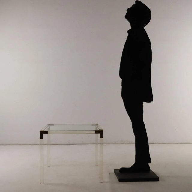 Vintage coffee table with acrylic glass and brass structure and glass top. This piece is attributed to the mentioned...