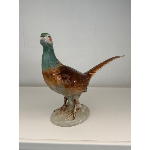 Beautiful porcelain statuette depicting a pheasant, with rich colors and exquisite detail. Made by the famous Royal Dux...