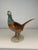 Beautiful porcelain statuette depicting a pheasant, with rich colors and exquisite detail. Made by the famous Royal Dux...