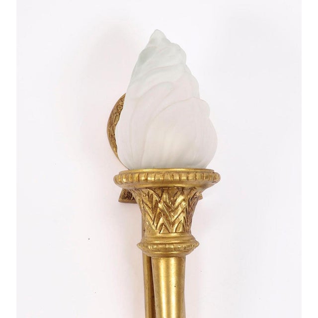 This is a superb pair of stylish French Neo-classical ormolu & glass flaming torch wall lights, circa 1920 in date. Each...