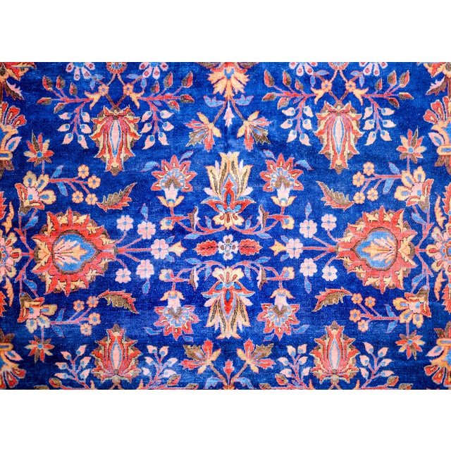 A beautiful 19th century antique Kashan rug with a central field containing myriad mirrored floral pattern woven in...