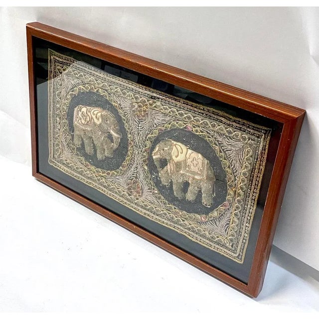 Framed vintage Thai hand-embroidered elephant Kalaga with stone and shell sequins and semi-precious stones. Depicts...