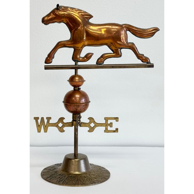 Vintage copper horse weathervane with embossed brass base. Mid-late 20th century piece. Perfect for decorating a desk,...