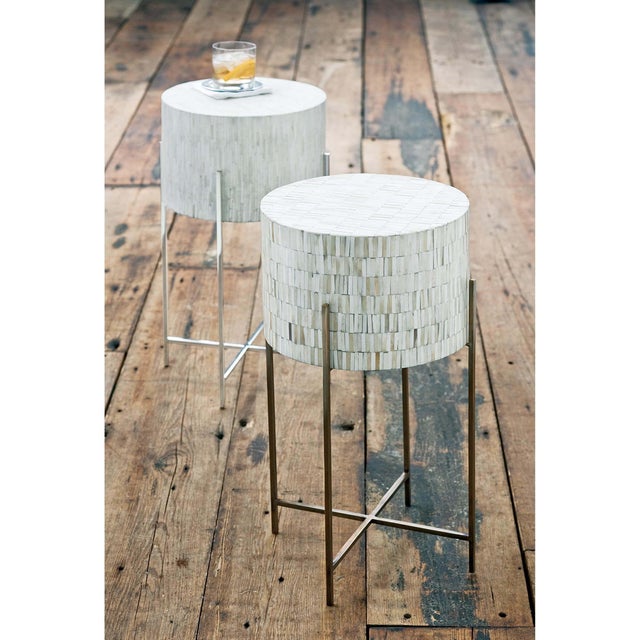 All the elements of this unique table come together perfectly: the intricate inlaid bone, the soft shape, and nickel legs,...