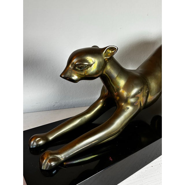 Large vintage brass panther sculpture made in Korea in 1987. Elegant Art Deco inspired design with a rich aged brass...