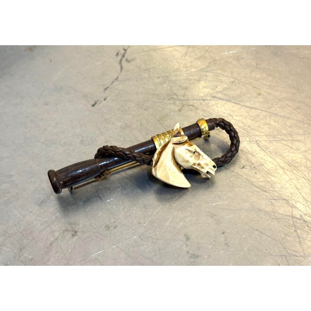 1950s-60s carved bone horse head equestrian style brooch/pin w/ gold tone metal, wood and leather detail. Some mild...
