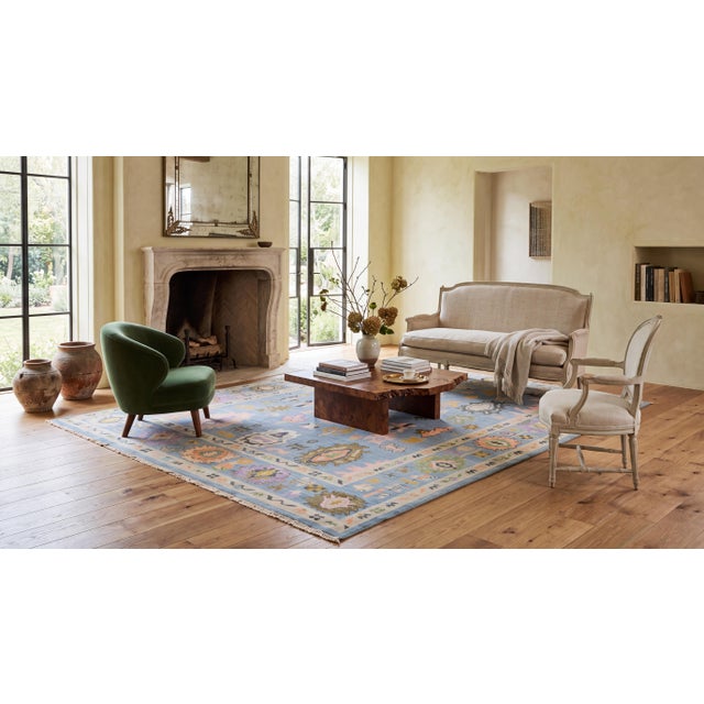 Elevate your space with this stunning modern Oushak-style area rug, hand-crafted from premium wool for exceptional texture...