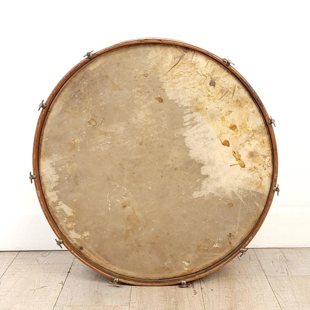 A vintage drum, U.S.A., 1920s or earlier. In antique condition. One side leather undamaged, the other with small tear....