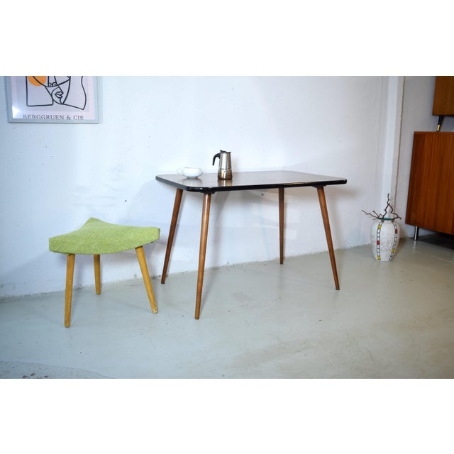 This is a minimalist mid-century table from the 1950s. The table is lightweight and compact, making it suitable as a...