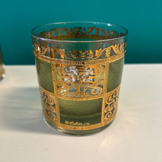 Set of 6 Culver Ltd lowball cocktail glasses. The glass has green tint and applied gold creating this wonder and swanky...