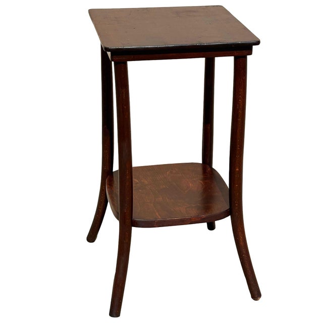 Turn of the century Art Nouveau bent oak pedestal side table number 1548 by Thonet featuring a sculptural frame crafted...