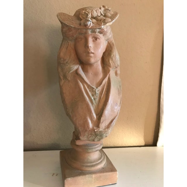 Victorian woman made of sculpted cast 1991 Alva signed. It is a heavy sculpture a beautiful conversation piece.
