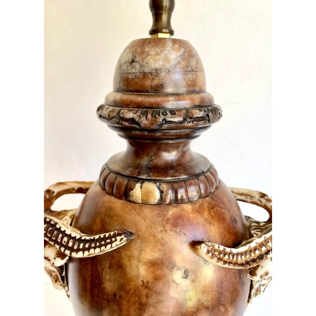 Here is a stunning lamp made of veined brown and cream alabaster marble. The lamp has a traditional urn shape with square...