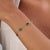This elegant station chain bracelet features 2.84ct of natural emeralds, 14K white gold. The emeralds in a variety of...