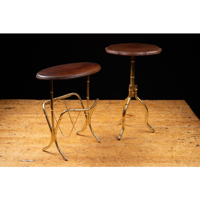 Matching pair of Maison Bagues-inspired occasional tables featuring brass-finished faux bamboo metal bases with dark-...