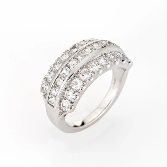 Finely detailed vintage mid-century diamond band (circa 1950s to 1960s) crafted in platinum. Centre set French cut...
