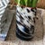 Maine made blown glass vase by artist David Jacobson. Signed on the bottom. Blue, charcoal and cream topped with a red...