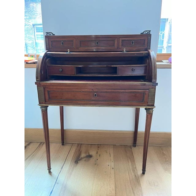 An exceptional and finely crafted French Louis XVI style cylinder desk (bureau à cylindre), dating from the mid-to-late...
