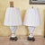 These Italian Capodimonte lamps bring together ornate sculpted ceramic, soft white and gold detailing, and a tall, elegant...