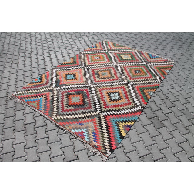 This beautiful, vintage, handwoven kilim is approximately 60 years old. It is handmade, of very fine quality hand spun...