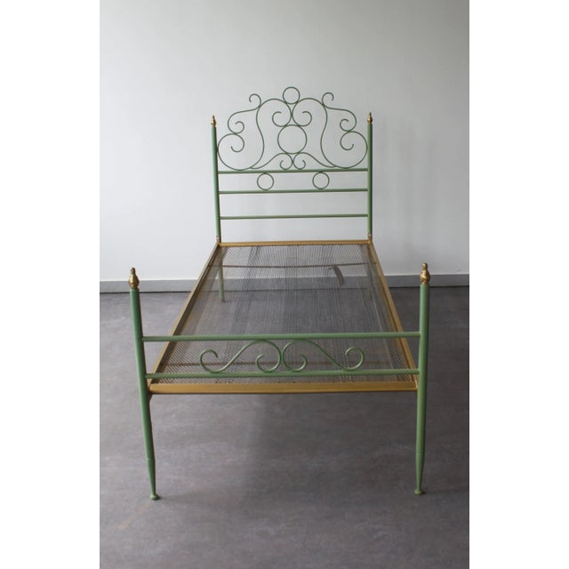 Vintage wrought iron bed, made in Tuscany in the 1960s. Elegant scrolled frame with almond green lacquer finish....
