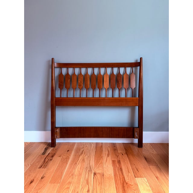 Perfect example of functional art. Crafted of sculpted solid black walnut with beautifully distinguished grain patterns...