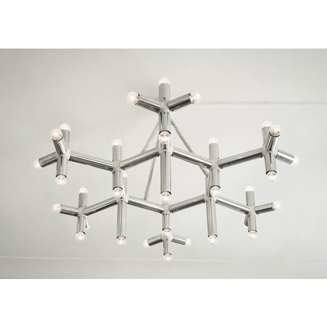 Stylish large chandelier /ceiling lamp, model Atomic. In beautiful condition. Designed by Trix & Robert Haussmann, made...