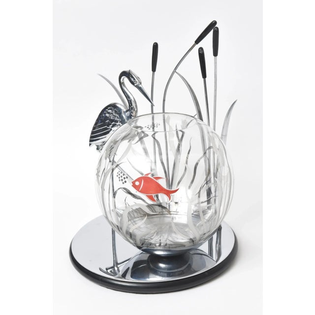Rare Art Deco piece featuring a crane or heron walking amongst a group of cattails while watching fish in the water. The...