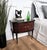 Very elegant and refined Italian 1950s Mid-Century Modern design, pair of bedside tables with double front door, light...
