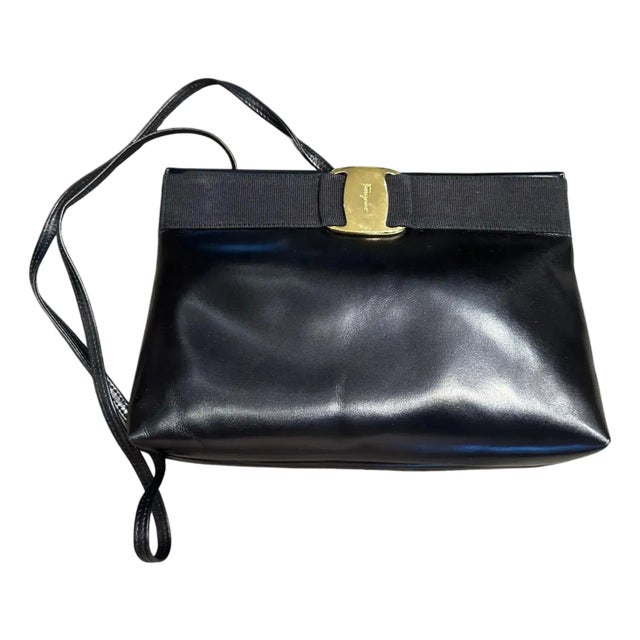 A 1990s Black Leather and Brass Shoulder Bag by Salvatore Ferragamo For Sale
