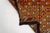 This is a vintage Turkish Oushak rug from the Mid 20th Century. The piece was hand-knotted.