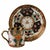 Intricate geometric fretwork and stylised lotus palmettes cover the exterior of this straight-sided demitasse can and...