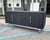 A Carved Wood credenza designed by the Spanish design studio Mermelada Estudio for CB2. This hand-carved, lacquered,...