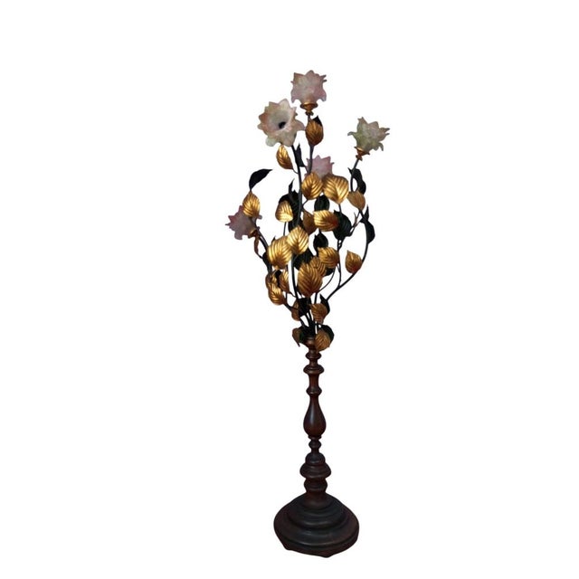 An elegant floor lamp, Italian-made in the 1960s, with a sculptural structure inspired by a rose bush. The turned wooden...