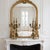 An exquisite, collector-grade pair of 16.5-inch five-arm candelabras embodying the dramatic flair and opulent symmetry of...