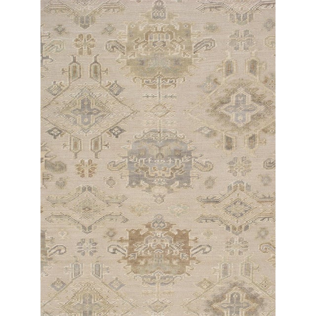 Expertly hand-knotted from fine wool, this Oushak rug showcases the collection's signature large-scale semi-geometric...