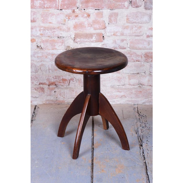 Maximum height: 65 cm (25.6 in) Minimum height: 43 cm (16.9 in) Diameter: 40 cm (15.7 in) This piano stool is a...