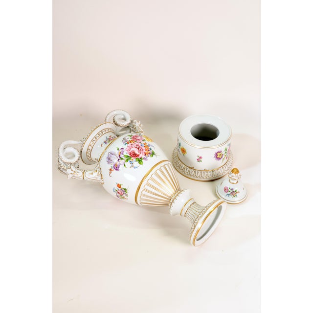 An impressive 100 cm tall lidded vase with a 30 cm diameter and 22 cm high base, beautifully gilded. This is followed by a...