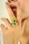 Elevate your style with this exquisite floral-inspired cocktail ring, crafted in 14k yellow gold. Featuring two vivid...
