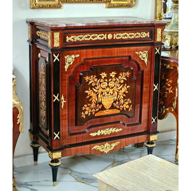 Bring timeless French sophistication into your home with this elegant French Louis XVI Accent Cabinet, masterfully...