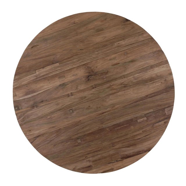 Salvaged solid teak wood sculptural round coffee table showcasing the natural beauty and character of reclaimed wood. The...