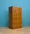 A 1930s Art Deco two-door cabinet, beautifully veneered in burr walnut and walnut with geometric veneers. Originally made...