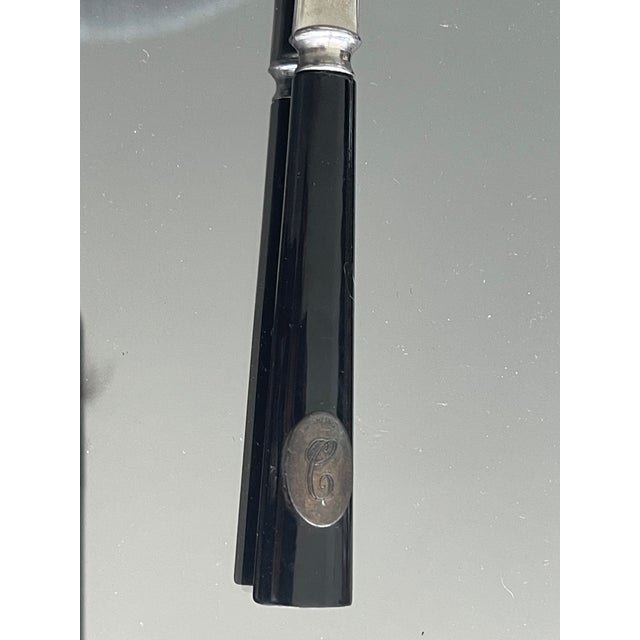Vintage letter opener with Bakelite handle with a small oval plaque with letter C and inscribed sterling.