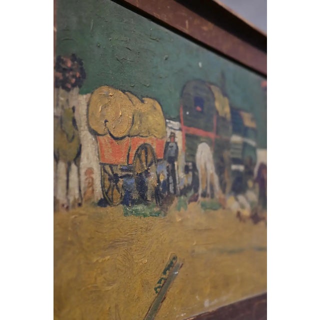 A framed reproduction of Van Goghs Encampment of Gypsies, hand painted oil on artistboard. "The area surrounding Arles and...