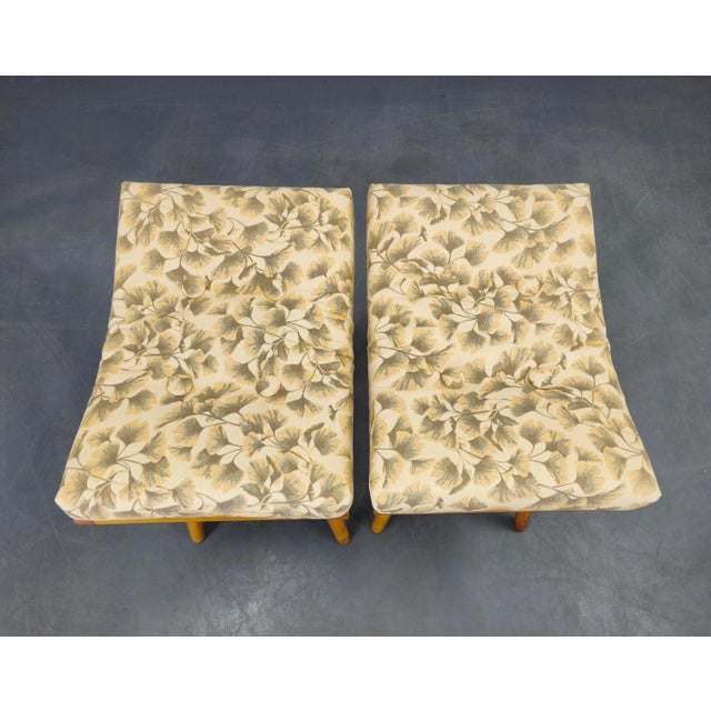 Pair of mid-century modern footstools produced in Czechoslovakia during the 1960s. The stools feature solid maple wood...