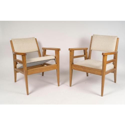 Pair of 1950s oak armchairs, convertible, two seat heights. Pair of 1950s oak armchairs, convertible from armchair to...
